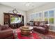 Comfortable living room with a plush leather sofa, entertainment center, and bright natural light at 417 Pennington Loop, Myrtle Beach, SC 29588