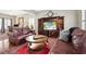 Cozy living room featuring a large entertainment center, leather sofas, and a decorative area rug at 417 Pennington Loop, Myrtle Beach, SC 29588