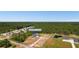 Stunning aerial view of the property featuring a modern farmhouse, pond, lush greenery, and a serene, private setting at 4426 Still Pond Rd., Conway, SC 29526