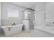 Modern bathroom with a standalone tub, glass-enclosed shower, and sleek fixtures at 4426 Still Pond Rd., Conway, SC 29526