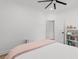 Bedroom with a soft pink bedspread and a bookshelf filled with books and decorative items at 4426 Still Pond Rd., Conway, SC 29526