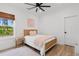 Cozy bedroom with a rattan bed frame, natural light, and hardwood floors for comfortable living at 4426 Still Pond Rd., Conway, SC 29526