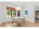 Bright dining area with wicker chairs, pendant lighting, and a large window at 4426 Still Pond Rd., Conway, SC 29526