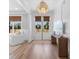 Bright foyer featuring double doors, wood floors, and stylish light fixture at 4426 Still Pond Rd., Conway, SC 29526
