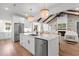Open kitchen with white cabinetry, stainless steel appliances, and a large island at 4426 Still Pond Rd., Conway, SC 29526