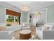 Cozy living room with natural light, comfortable seating, and stylish light fixture at 4426 Still Pond Rd., Conway, SC 29526