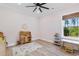 Bright playroom with natural light, wooden toy kitchen, and a rug for to enjoy at 4426 Still Pond Rd., Conway, SC 29526