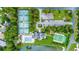 Aerial of community amenities: swimming pool, tennis, pickleball courts, and parking at 455 Dornoch Dr., Pawleys Island, SC 29585
