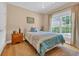 Charming bedroom with a large window, hardwood floors, and bright, natural light at 455 Dornoch Dr., Pawleys Island, SC 29585