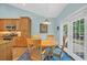 Cozy dining area with a wooden table, seating for four, and access to the patio at 455 Dornoch Dr., Pawleys Island, SC 29585