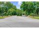 Entrance to Heritage Plantation with manicured greenery and directional signage at 455 Dornoch Dr., Pawleys Island, SC 29585