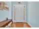 Elegant foyer with hardwood floors and light blue walls, leading into the home at 455 Dornoch Dr., Pawleys Island, SC 29585