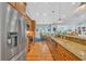 Modern kitchen with stainless steel appliances, granite countertops, and hardwood floors at 455 Dornoch Dr., Pawleys Island, SC 29585