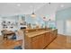 Open-concept kitchen with a bar, granite countertops, and modern appliances at 455 Dornoch Dr., Pawleys Island, SC 29585