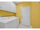 Convenient laundry room with washer, dryer, and ample storage space at 455 Dornoch Dr., Pawleys Island, SC 29585
