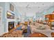 Bright and airy living room with a fireplace, hardwood floors, and open-concept design at 455 Dornoch Dr., Pawleys Island, SC 29585