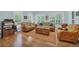 Comfortable sitting area with wicker furniture, natural light, and hardwood floors at 455 Dornoch Dr., Pawleys Island, SC 29585