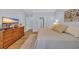Comfortable main bedroom with hardwood floors, dresser, and ensuite bathroom access at 455 Dornoch Dr., Pawleys Island, SC 29585