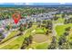 An aerial view of a condo complex on a golf course and beautiful waterfront property and city in the distance at 4773 Wild Iris Dr. # 301, Myrtle Beach, SC 29577