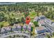 Aerial shot of condos with golf course, pond and community pool, providing a balanced lifestyle at 4773 Wild Iris Dr. # 301, Myrtle Beach, SC 29577