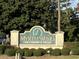 Entrance sign to the Myrtlewood Golf Resort & Villas with manicured landscaping around the base at 4773 Wild Iris Dr. # 301, Myrtle Beach, SC 29577