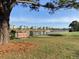 A view of the Intracoastal Waterway with a sign indicating distances to Miami and New York with lovely homes in the background at 4773 Wild Iris Dr. # 301, Myrtle Beach, SC 29577
