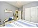 Serene bedroom with soft blue accents, a comfortable bed, and closet at 512 Chanted Dr., Murrells Inlet, SC 29576