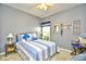 Calming bedroom with striped bedding, soft lighting, and a decorated wall mirror at 512 Chanted Dr., Murrells Inlet, SC 29576