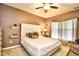 Comfortable bedroom featuring a ceiling fan and large window at 512 Chanted Dr., Murrells Inlet, SC 29576