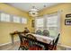 Bright dining room with windows, chandelier, and wood floors at 512 Chanted Dr., Murrells Inlet, SC 29576