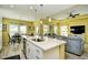 Open-concept kitchen with a large island seamlessly connecting to the living room and dining area at 512 Chanted Dr., Murrells Inlet, SC 29576