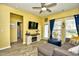 Bright living room with yellow walls, modern furniture, and a decorative fireplace at 512 Chanted Dr., Murrells Inlet, SC 29576