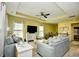 Bright living room with yellow walls, recessed ceiling, and comfortable furnishings, offering an inviting gathering space at 512 Chanted Dr., Murrells Inlet, SC 29576