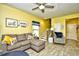 Inviting living room with a comfortable sectional sofa and staircase access at 512 Chanted Dr., Murrells Inlet, SC 29576