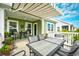 Relaxing outdoor space with comfortable seating, a ceiling fan, and a view of the well-maintained backyard at 512 Chanted Dr., Murrells Inlet, SC 29576