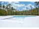 Inviting community pool surrounded by mature trees and ample space for relaxation and recreation at 512 Chanted Dr., Murrells Inlet, SC 29576