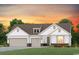 Charming single-Gathering home boasts a three-car garage and well-maintained front yard at 543 Oak Landing Dr., Myrtle Beach, SC 29588