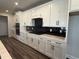 Spacious kitchen featuring stainless steel appliances, white cabinets, modern hardware and backsplash at 543 Oak Landing Dr., Myrtle Beach, SC 29588