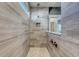 Modern shower featuring gray tile, a rainfall showerhead, and a built-in niche at 543 Oak Landing Dr., Myrtle Beach, SC 29588