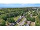 Aerial view of a home in a wooded neighborhood near a coastline at 558 Juniper Dr., Myrtle Beach, SC 29577