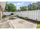 Backyard featuring a white fence, patio, and small garden area at 558 Juniper Dr., Myrtle Beach, SC 29577