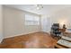 Bedroom with parquet floors, ceiling fan, window, and desk area at 558 Juniper Dr., Myrtle Beach, SC 29577
