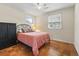 Cozy bedroom with wood floors, ceiling fan, and natural light at 558 Juniper Dr., Myrtle Beach, SC 29577
