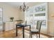 Cozy dining area with a wooden table set by a bright window at 558 Juniper Dr., Myrtle Beach, SC 29577