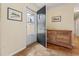 Welcoming entryway with parquet floors, and a unique wooden dresser at 558 Juniper Dr., Myrtle Beach, SC 29577