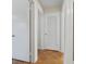 Hallway showcasing wooden floors and multiple closets at 558 Juniper Dr., Myrtle Beach, SC 29577