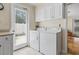 Laundry area with washer, dryer, and access to the backyard at 558 Juniper Dr., Myrtle Beach, SC 29577