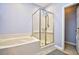 Tiled bathroom with a glass enclosed shower and a white bathtub at 5813 Mossy Oaks Dr., North Myrtle Beach, SC 29582