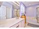 Bright bathroom features a double vanity, soaking tub, and a walk-in shower at 5813 Mossy Oaks Dr., North Myrtle Beach, SC 29582