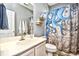 This bathroom has a sink vanity and a shower with an octopus themed curtain at 5813 Mossy Oaks Dr., North Myrtle Beach, SC 29582